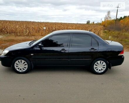 Чорний Міцубісі Lancer, об'ємом двигуна 1.6 л та пробігом 240 тис. км за 4950 $, фото 5 на Automoto.ua