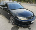 Чорний Міцубісі Lancer, об'ємом двигуна 2 л та пробігом 280 тис. км за 4600 $, фото 3 на Automoto.ua