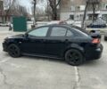 Черный Мицубиси Лансер, объемом двигателя 2 л и пробегом 205 тыс. км за 6500 $, фото 3 на Automoto.ua