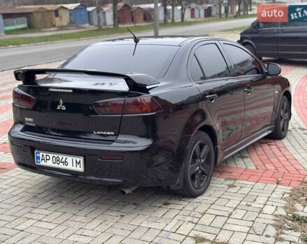 Черный Мицубиси Лансер, объемом двигателя 2 л и пробегом 217 тыс. км за 5500 $, фото 7 на Automoto.ua