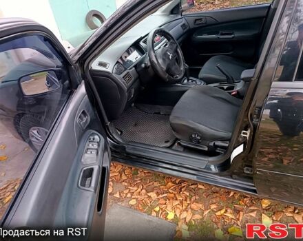 Чорний Міцубісі Lancer, об'ємом двигуна 1.6 л та пробігом 227 тис. км за 4100 $, фото 8 на Automoto.ua
