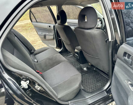 Черный Мицубиси Лансер, объемом двигателя 1.6 л и пробегом 216 тыс. км за 4990 $, фото 15 на Automoto.ua