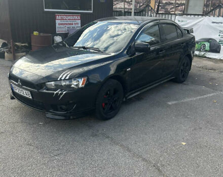 Черный Мицубиси Лансер, объемом двигателя 2 л и пробегом 208 тыс. км за 6500 $, фото 3 на Automoto.ua