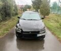 Черный Мицубиси Лансер, объемом двигателя 2 л и пробегом 250 тыс. км за 2708 $, фото 1 на Automoto.ua
