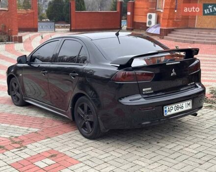 Черный Мицубиси Лансер, объемом двигателя 2 л и пробегом 217 тыс. км за 5500 $, фото 5 на Automoto.ua