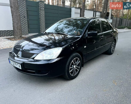 Черный Мицубиси Лансер, объемом двигателя 1.58 л и пробегом 278 тыс. км за 4800 $, фото 4 на Automoto.ua