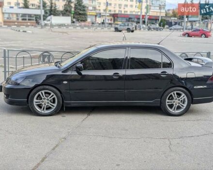 Чорний Міцубісі Lancer, об'ємом двигуна 2 л та пробігом 152 тис. км за 5500 $, фото 30 на Automoto.ua