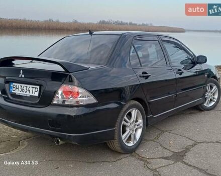 Черный Мицубиси Лансер, объемом двигателя 2 л и пробегом 286 тыс. км за 4000 $, фото 5 на Automoto.ua