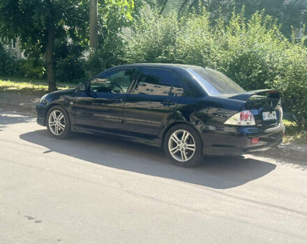 Чорний Міцубісі Lancer, об'ємом двигуна 2 л та пробігом 210 тис. км за 5500 $, фото 48 на Automoto.ua