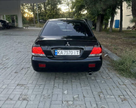 Черный Мицубиси Лансер, объемом двигателя 1.59 л и пробегом 269 тыс. км за 4999 $, фото 7 на Automoto.ua