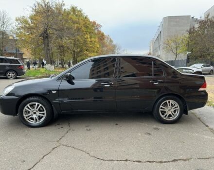 Черный Мицубиси Лансер, объемом двигателя 1.6 л и пробегом 173 тыс. км за 4700 $, фото 1 на Automoto.ua