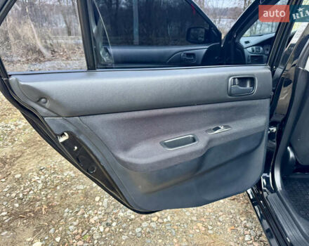 Черный Мицубиси Лансер, объемом двигателя 1.6 л и пробегом 216 тыс. км за 4990 $, фото 14 на Automoto.ua