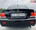 Черный Мицубиси Лансер, объемом двигателя 1.58 л и пробегом 243 тыс. км за 4950 $, фото 24 на Automoto.ua