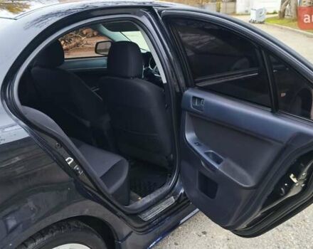 Черный Мицубиси Лансер, объемом двигателя 2 л и пробегом 230 тыс. км за 7100 $, фото 1 на Automoto.ua