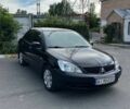 Чорний Міцубісі Lancer, об'ємом двигуна 1.58 л та пробігом 178 тис. км за 4700 $, фото 1 на Automoto.ua