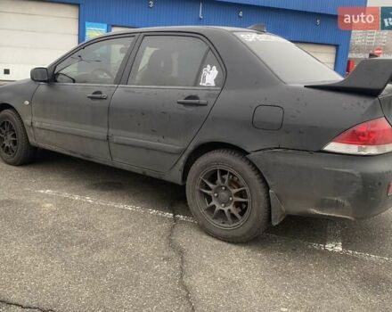 Черный Мицубиси Лансер, объемом двигателя 1.58 л и пробегом 263 тыс. км за 4000 $, фото 16 на Automoto.ua