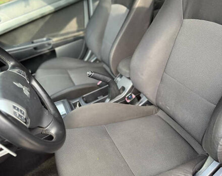 Черный Мицубиси Лансер, объемом двигателя 2 л и пробегом 219 тыс. км за 6400 $, фото 14 на Automoto.ua