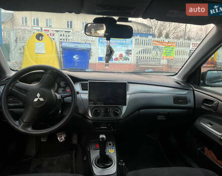 Черный Мицубиси Лансер, объемом двигателя 1.6 л и пробегом 180 тыс. км за 3499 $, фото 18 на Automoto.ua