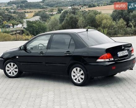 Чорний Міцубісі Lancer, об'ємом двигуна 1.6 л та пробігом 243 тис. км за 4950 $, фото 27 на Automoto.ua