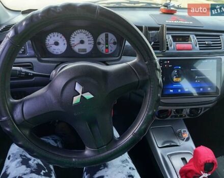 Черный Мицубиси Лансер, объемом двигателя 1.6 л и пробегом 320 тыс. км за 4500 $, фото 8 на Automoto.ua