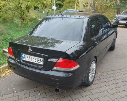 Чорний Міцубісі Lancer, об'ємом двигуна 1.58 л та пробігом 190 тис. км за 3750 $, фото 22 на Automoto.ua