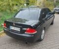 Чорний Міцубісі Lancer, об'ємом двигуна 1.58 л та пробігом 190 тис. км за 3750 $, фото 22 на Automoto.ua