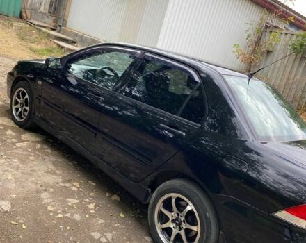 Чорний Міцубісі Lancer, об'ємом двигуна 1.6 л та пробігом 232 тис. км за 4200 $, фото 6 на Automoto.ua