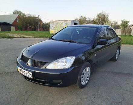 Черный Мицубиси Лансер, объемом двигателя 1.6 л и пробегом 32 тыс. км за 9000 $, фото 4 на Automoto.ua