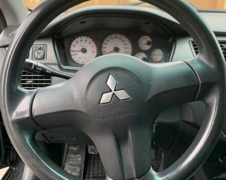 Черный Мицубиси Лансер, объемом двигателя 1.6 л и пробегом 164 тыс. км за 5200 $, фото 12 на Automoto.ua