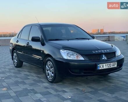 Чорний Міцубісі Lancer, об'ємом двигуна 1.58 л та пробігом 237 тис. км за 4300 $, фото 1 на Automoto.ua