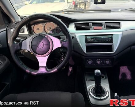 Черный Мицубиси Лансер, объемом двигателя 1.6 л и пробегом 260 тыс. км за 3700 $, фото 6 на Automoto.ua