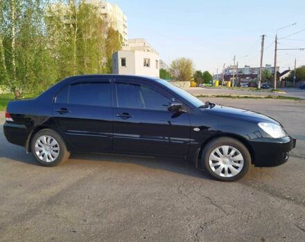 Черный Мицубиси Лансер, объемом двигателя 1.6 л и пробегом 32 тыс. км за 9000 $, фото 11 на Automoto.ua