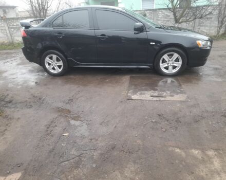 Черный Мицубиси Лансер, объемом двигателя 2 л и пробегом 215 тыс. км за 5700 $, фото 3 на Automoto.ua