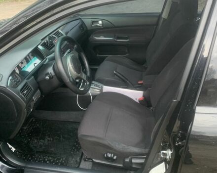 Черный Мицубиси Лансер, объемом двигателя 2 л и пробегом 240 тыс. км за 5600 $, фото 1 на Automoto.ua