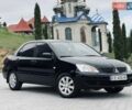 Черный Мицубиси Лансер, объемом двигателя 1.6 л и пробегом 243 тыс. км за 4950 $, фото 1 на Automoto.ua