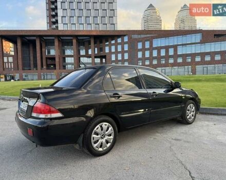 Черный Мицубиси Лансер, объемом двигателя 1.58 л и пробегом 237 тыс. км за 3999 $, фото 10 на Automoto.ua