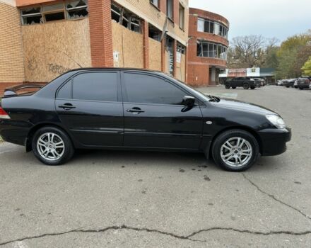 Черный Мицубиси Лансер, объемом двигателя 1.6 л и пробегом 173 тыс. км за 4700 $, фото 5 на Automoto.ua