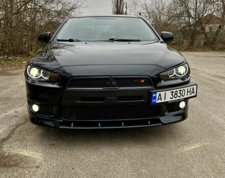 Черный Мицубиси Лансер, объемом двигателя 2 л и пробегом 164 тыс. км за 8300 $, фото 2 на Automoto.ua