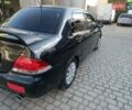 Черный Мицубиси Лансер, объемом двигателя 1.6 л и пробегом 275 тыс. км за 3999 $, фото 2 на Automoto.ua