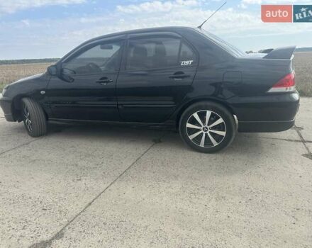 Чорний Міцубісі Lancer, об'ємом двигуна 1.6 л та пробігом 310 тис. км за 5100 $, фото 19 на Automoto.ua