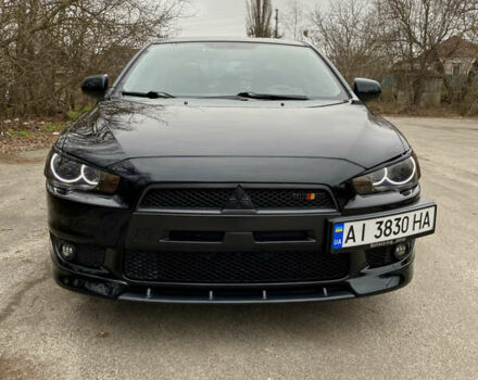 Черный Мицубиси Лансер, объемом двигателя 2 л и пробегом 164 тыс. км за 8300 $, фото 3 на Automoto.ua