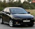 Чорний Міцубісі Lancer, об'ємом двигуна 2 л та пробігом 321 тис. км за 5799 $, фото 1 на Automoto.ua