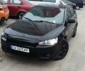 Черный Мицубиси Лансер, объемом двигателя 2 л и пробегом 205 тыс. км за 4650 $, фото 1 на Automoto.ua