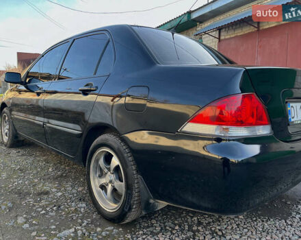 Черный Мицубиси Лансер, объемом двигателя 1.58 л и пробегом 156 тыс. км за 4599 $, фото 7 на Automoto.ua