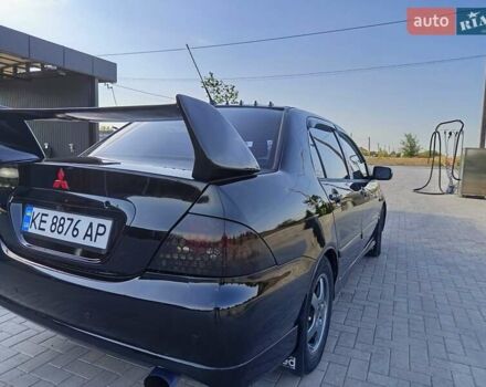 Черный Мицубиси Лансер, объемом двигателя 1.6 л и пробегом 320 тыс. км за 4500 $, фото 4 на Automoto.ua