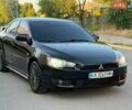 Черный Мицубиси Лансер, объемом двигателя 2 л и пробегом 270 тыс. км за 5800 $, фото 1 на Automoto.ua