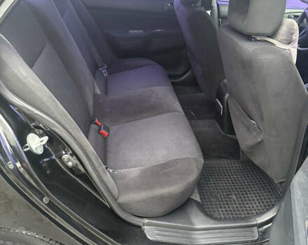 Чорний Міцубісі Lancer, об'ємом двигуна 1.58 л та пробігом 256 тис. км за 3700 $, фото 21 на Automoto.ua