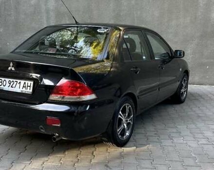 Чорний Міцубісі Lancer, об'ємом двигуна 1.58 л та пробігом 135 тис. км за 4100 $, фото 3 на Automoto.ua