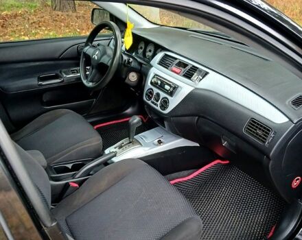 Чорний Міцубісі Lancer, об'ємом двигуна 1.6 л та пробігом 240 тис. км за 4700 $, фото 9 на Automoto.ua