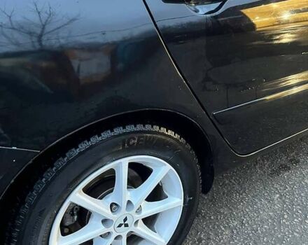 Черный Мицубиси Лансер, объемом двигателя 1.6 л и пробегом 249 тыс. км за 5000 $, фото 20 на Automoto.ua